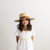 Gigi Pip straw hats for kids - Capri Medium Kids - boater crown with a medium flat brim featuring a band around the crown [natural]