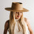 Gigi Pip straw hats for women - Aiden Straw Pork Pie - telescope crown wide brim boater featuring a tonal wooden bead on a genuine leather chinstrap [natural]